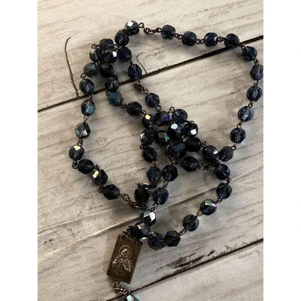 A vintage blue glass bead rosary with a silver-toned metal crucifix and medal. - Picture 5 of 10